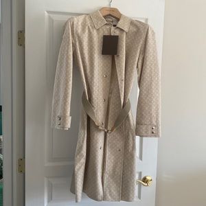 Louis Vuitton monogrammed trench coat with belt. Never worn. Comes with tags